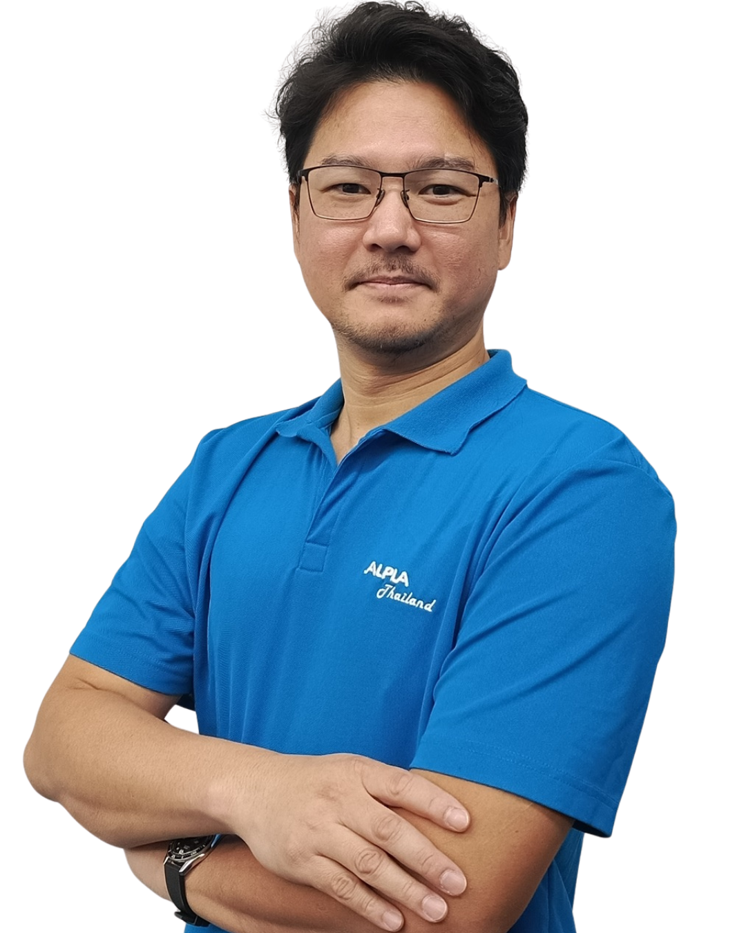 Business Development manager Man in blue ALPLA Thailand shirt with crossed arms and glasses, looking confident.