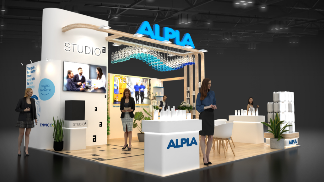 ALPLA exhibition booth with product displays and LED screens in a modern setting.