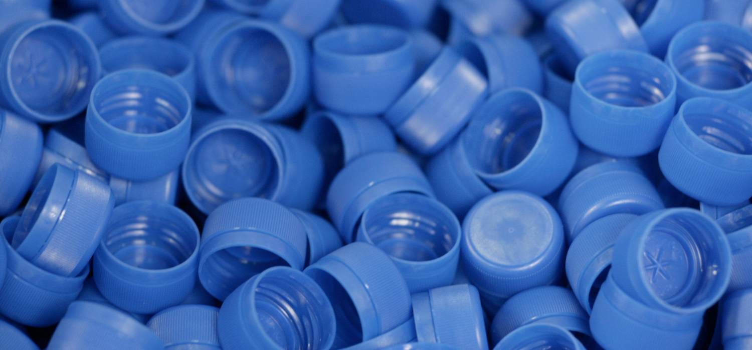 Many blue caps for plastic packaging from ALPLA