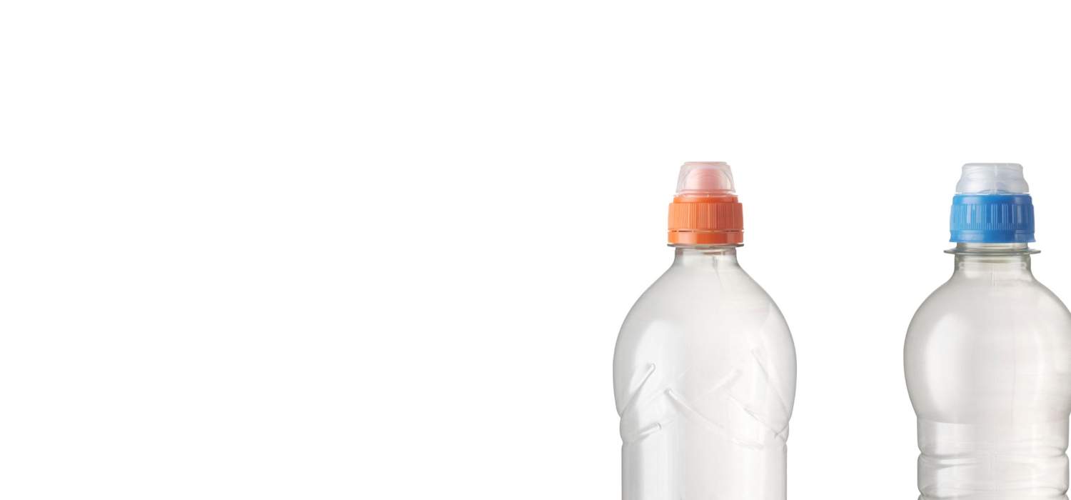 Two clear plastic bottles with orange and blue caps.
