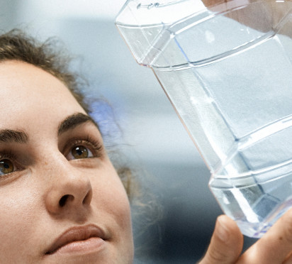 ISBM technology employee with bottle