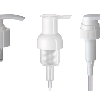 Five white plastic pump dispensers in a row.