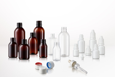 Brown and white plastic bottles with caps on a white background.