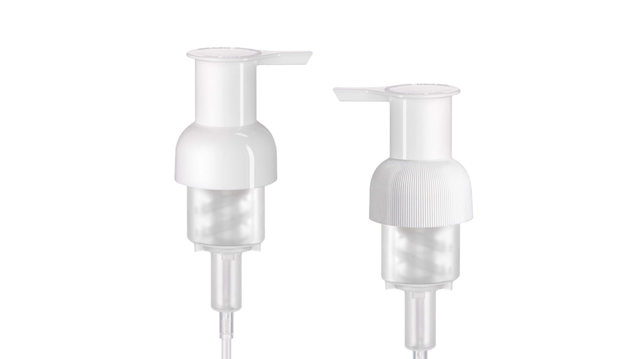 White pump dispensers with transparent base on a white background.