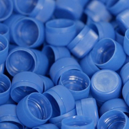 Many blue caps for plastic packaging from ALPLA