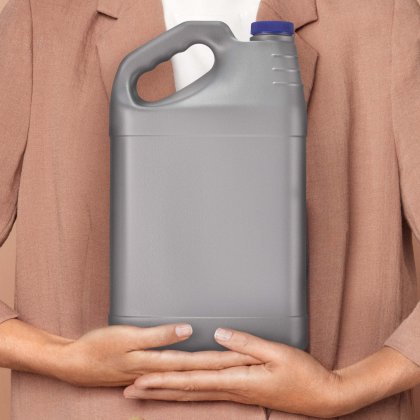 Gray plastic jug with a blue cap held in hands.