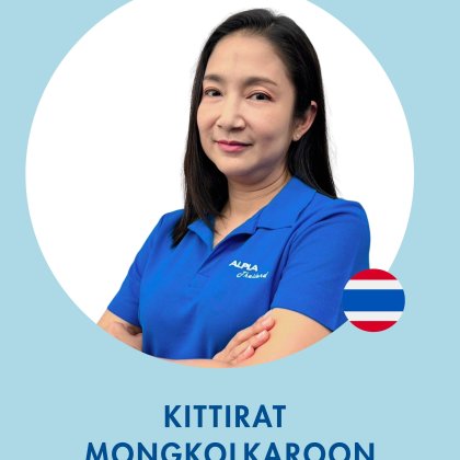 Business Development Manager at ALPLA women in blue ALPLA shirt, arms crossed, with Thai flag icon.